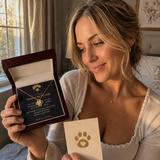 Happy customer holding the gold Love Knot pet memorial necklace gift box